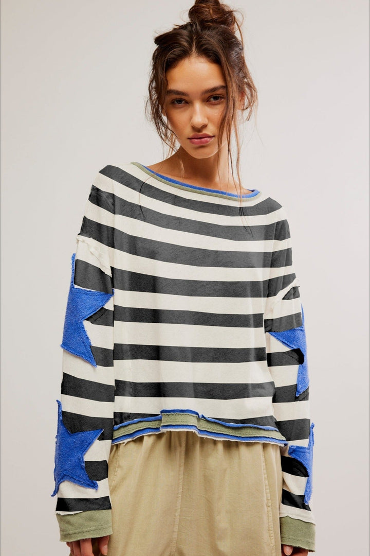 Wiosenno-jesienna bluza damska oversize. Modny fason z dużą, wyrazistą gwiazdą. Swobodny styl.