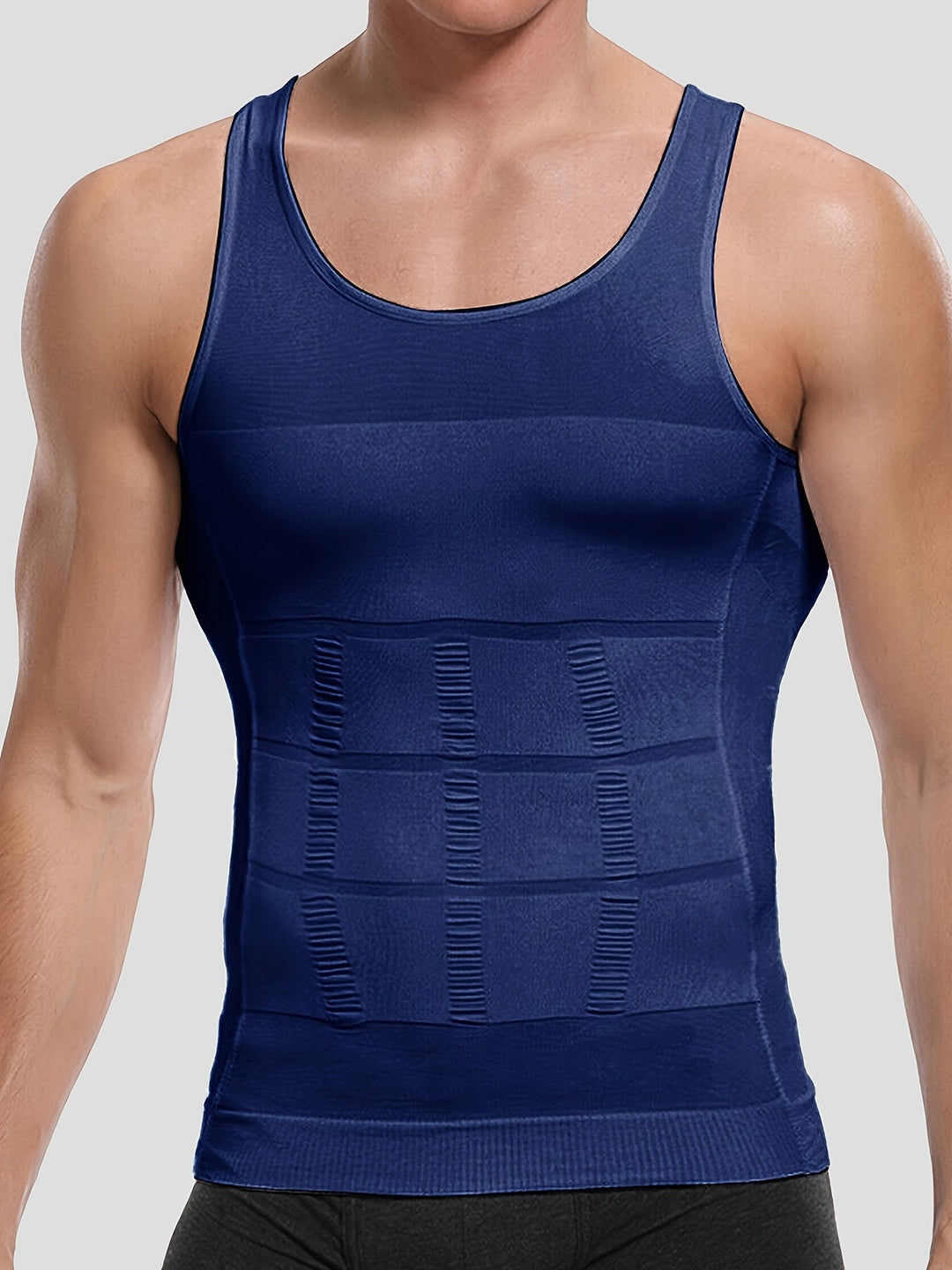Męska koszulka kompresyjna tank top. Odzież sportowa bez rękawów, wspiera mięśnie na siłowni.