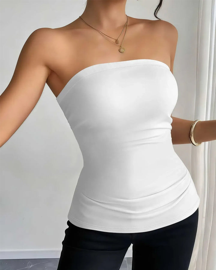 Modny damski top bandeau, gładki i bez ramiączek. Uniwersalny fason na lato.