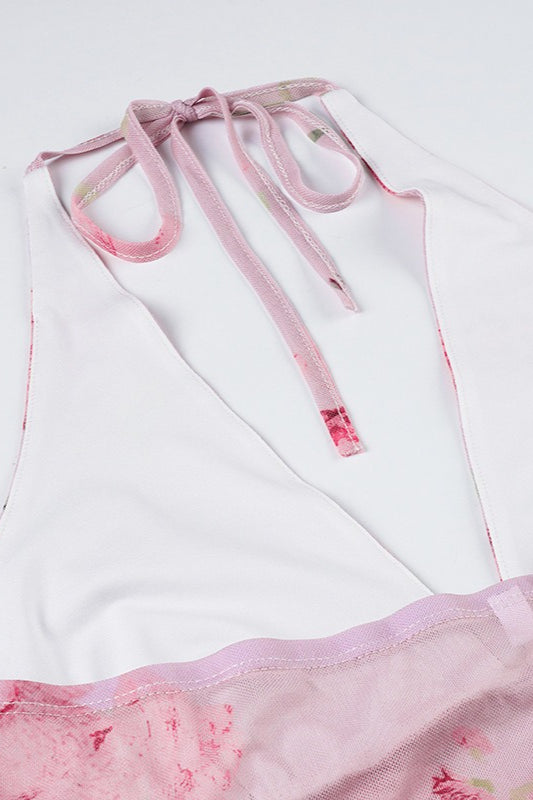 Różowy top halter damski z delikatnym, kwiatowym wzorem. Modny letni top, dopasowany krój.