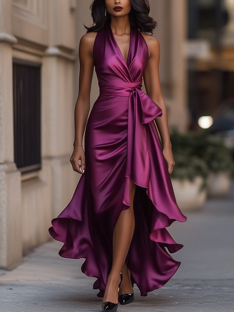 Damska sukienka midi elegancka, z wiązaną talią, dekoltem halter i modnym asymetrycznym dołem.