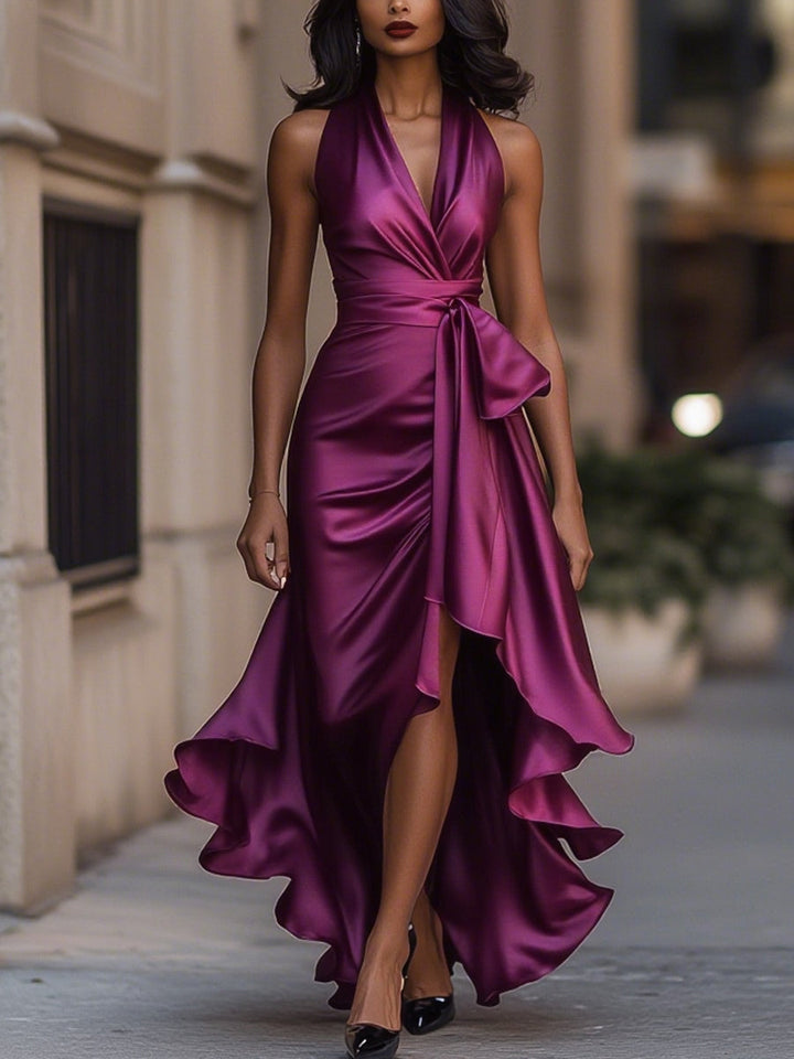 Damska sukienka midi elegancka, z wiązaną talią, dekoltem halter i modnym asymetrycznym dołem.