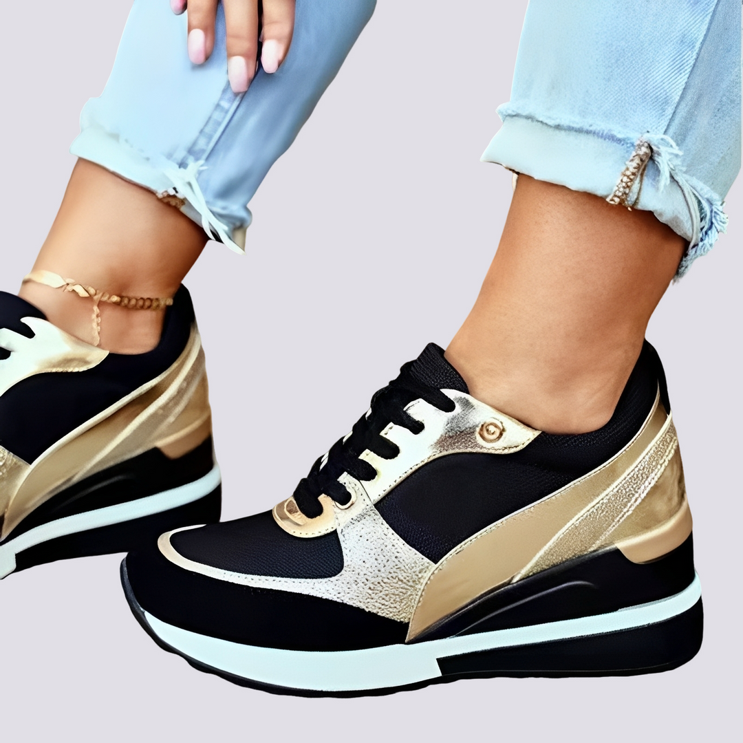 Damskie stylowe sneakersy na platformie w modnym połączeniu złota i czerni. Wygodne buty z podwyższoną podeszwą.