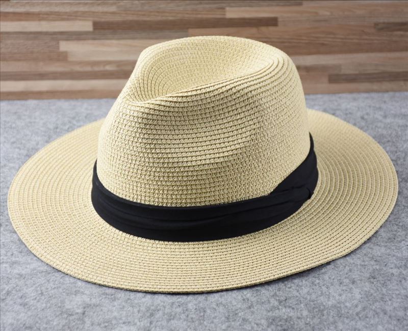 Elegancki damski kapelusz słomkowy Panama z szerokim rondem, idealny na plażę i wakacje. Zapewnia ochronę.
