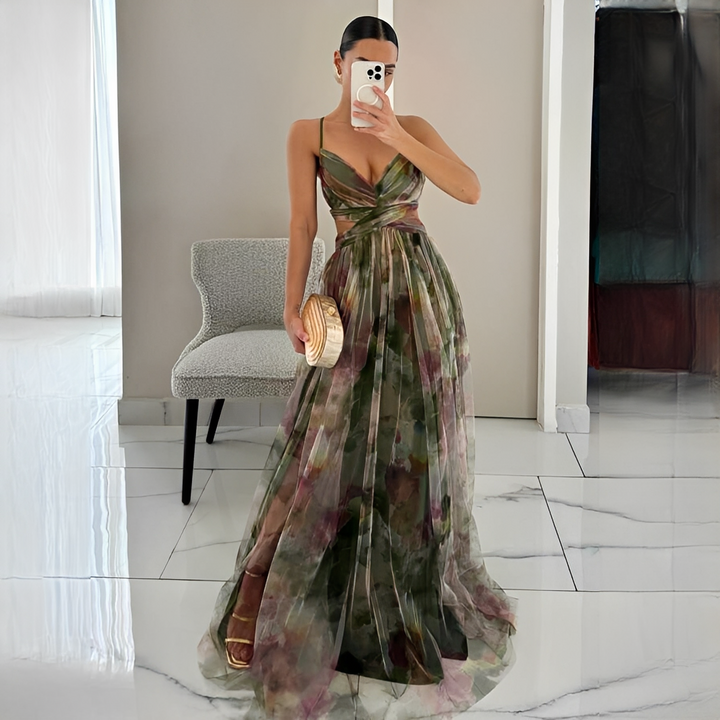 Zjawiskowa wzorzysta sukienka maxi damska, idealna na letnie przyjęcia. Różowo-zielone kwiaty dodają elegancji.