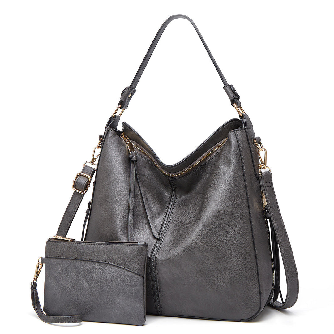 Podróżna skórzana torba na ramię dla kobiet, z bezpiecznymi przegrodami i eleganckim złotym wykończeniem.