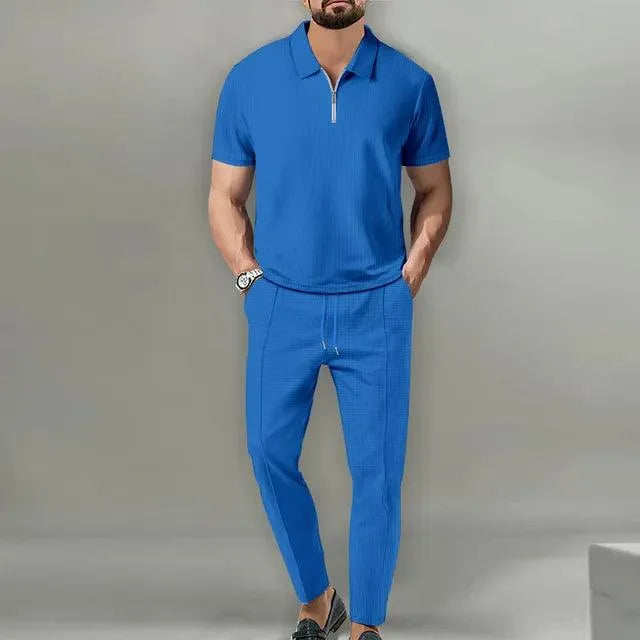 Męska bawełniana koszulka polo i eleganckie spodnie. Wygodny i modny zestaw na co dzień, do pracy lub relaks.