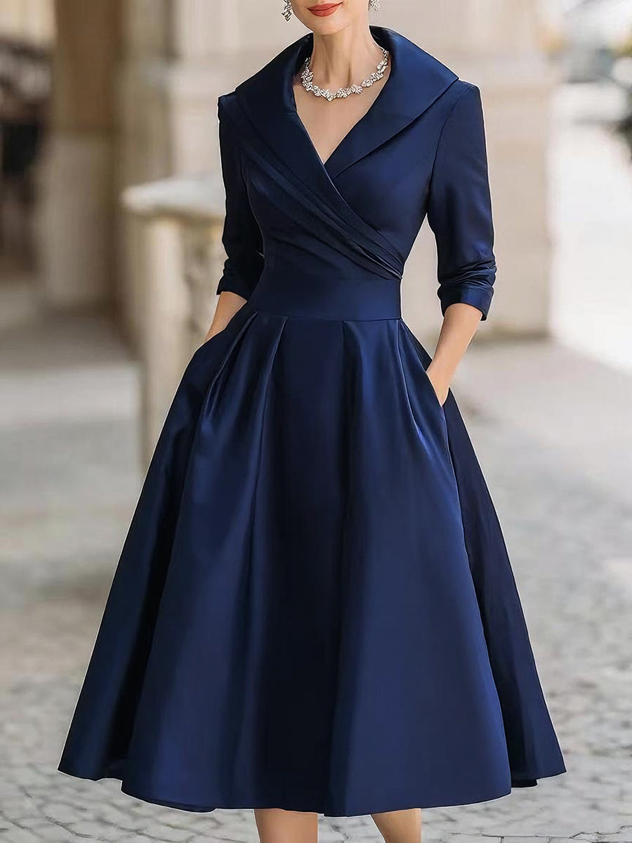 Rozkloszowana sukienka midi damska z kopertowym dekoltem. Elegancka i stylowa.