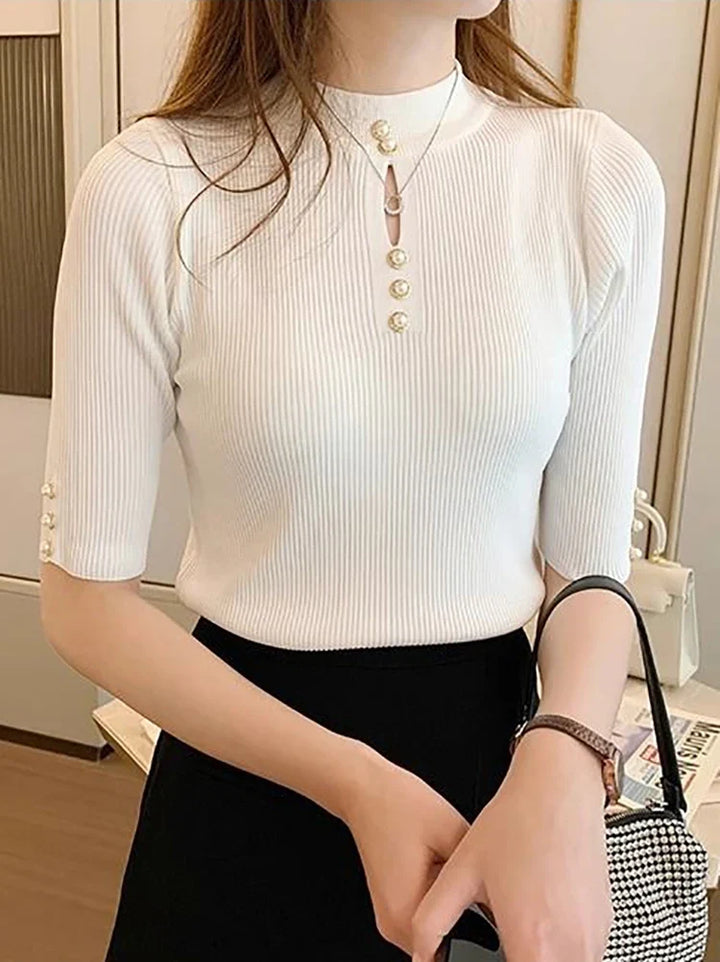 Dzianinowy sweter damski z krótkim rękawem, modny design, idealny do wiosennych stylizacji.