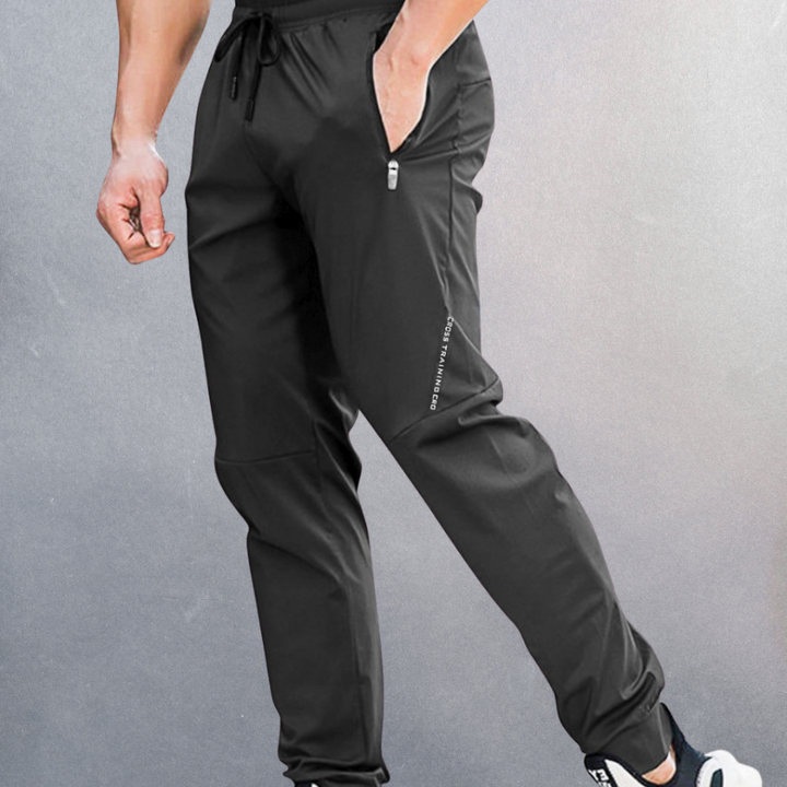 Oddychające męskie spodnie casual z tkaniny broadcloth. Wygodne dresy sportowe z elastycznym pasem na wiosnę.