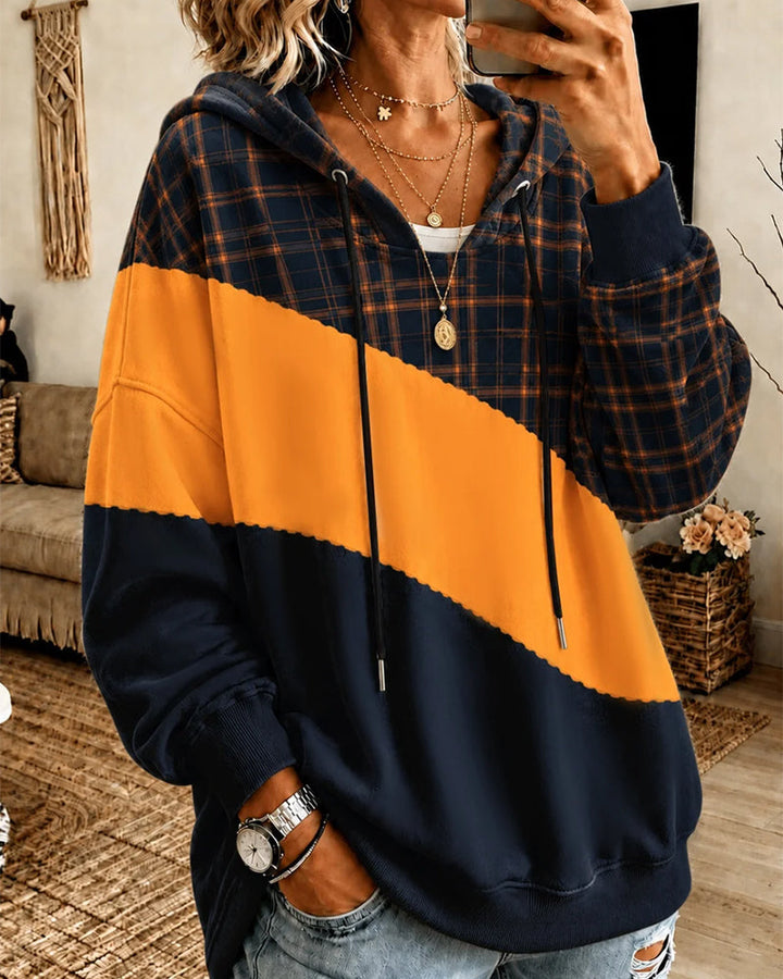 Uniwersalna bluza z kapturem unisex w stylu casual. Pomarańczowa z kontrastowymi panelami, idealna na co dzień.