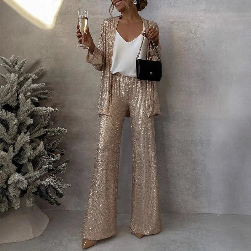 Elegancki damski cekinowy zestaw: top i spodnie z wysokim stanem. Idealny na wieczorowe wyjścia, modny look.