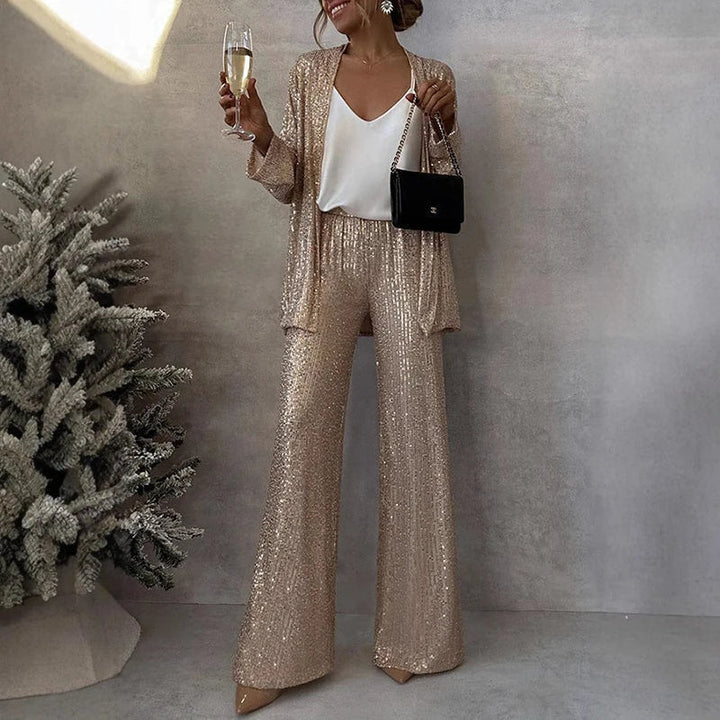 Elegancki damski cekinowy zestaw: top i spodnie z wysokim stanem. Idealny na wieczorowe wyjścia, modny look.