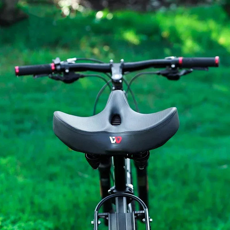Siodełko rowerowe z podwójną amortyzacją, szerokie, ergonomiczne, zwiększa wygodę jazdy na e-bike.