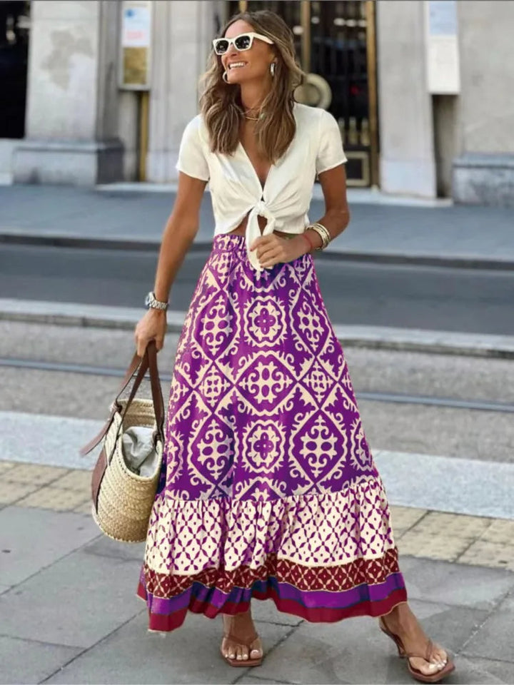 Damska spódnica maxi z elastycznym pasem, długi krój, wzór kwiatowy boho, do casualowych stylizacji.