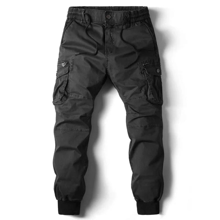 Stylowe joggery męskie cargo utility. Nowoczesne spodnie z kieszeniami, streetwear, casualowa odzież męska.