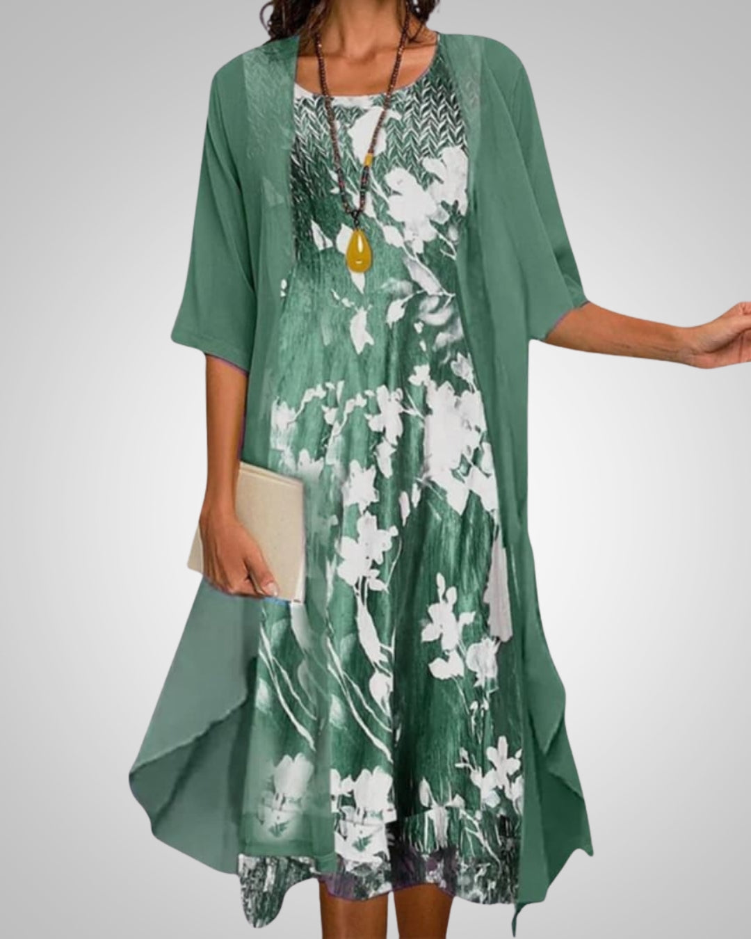 Modna damska sukienka midi w stylu boho z barwnym kwiatowym nadrukiem. Idealna na lato i wiosnę.