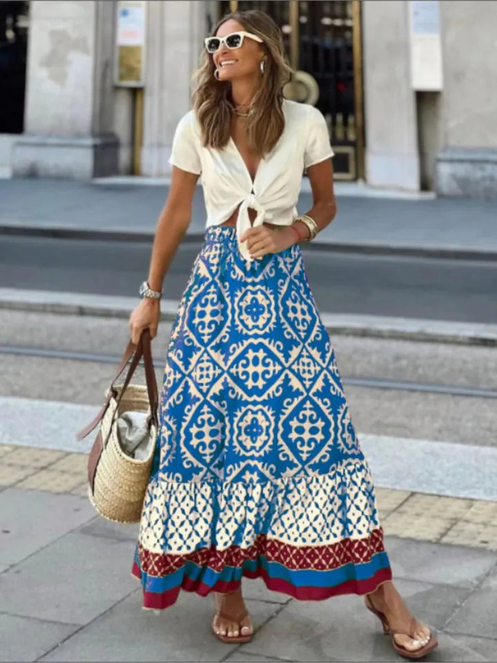 Modna długa spódnica damska boho, zwiewna, kwiatowa, z elastycznym pasem. Wiosenno-letnia maxi.