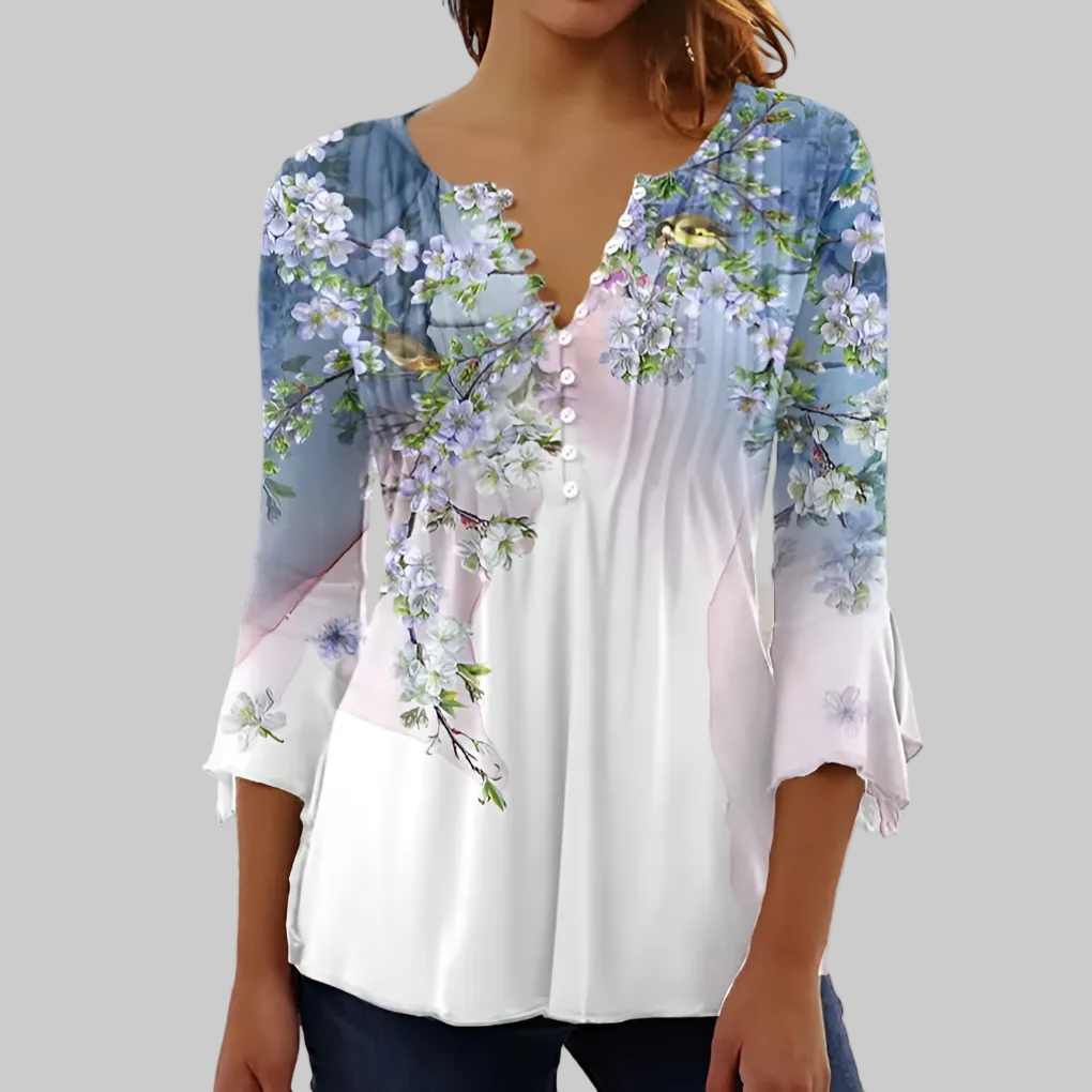 Elegancki top na lato w delikatny wzór, z dopasowanymi zaszewkami. Modna bluzka bez zagnieceń.