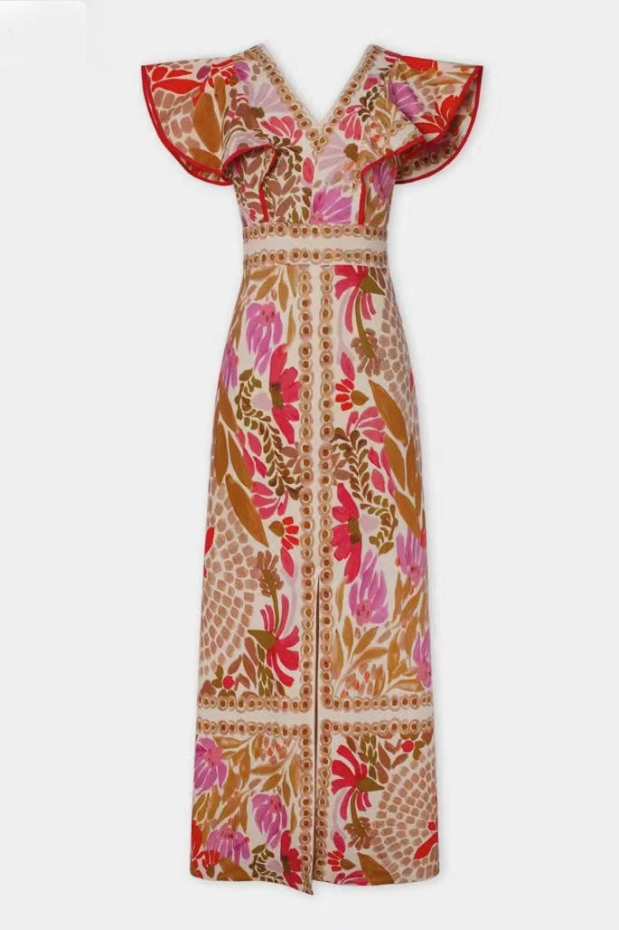 Damska sukienka maxi boho w kwiaty z dekoltem V i falbanami. Modna, letnia propozycja na wakacje.
