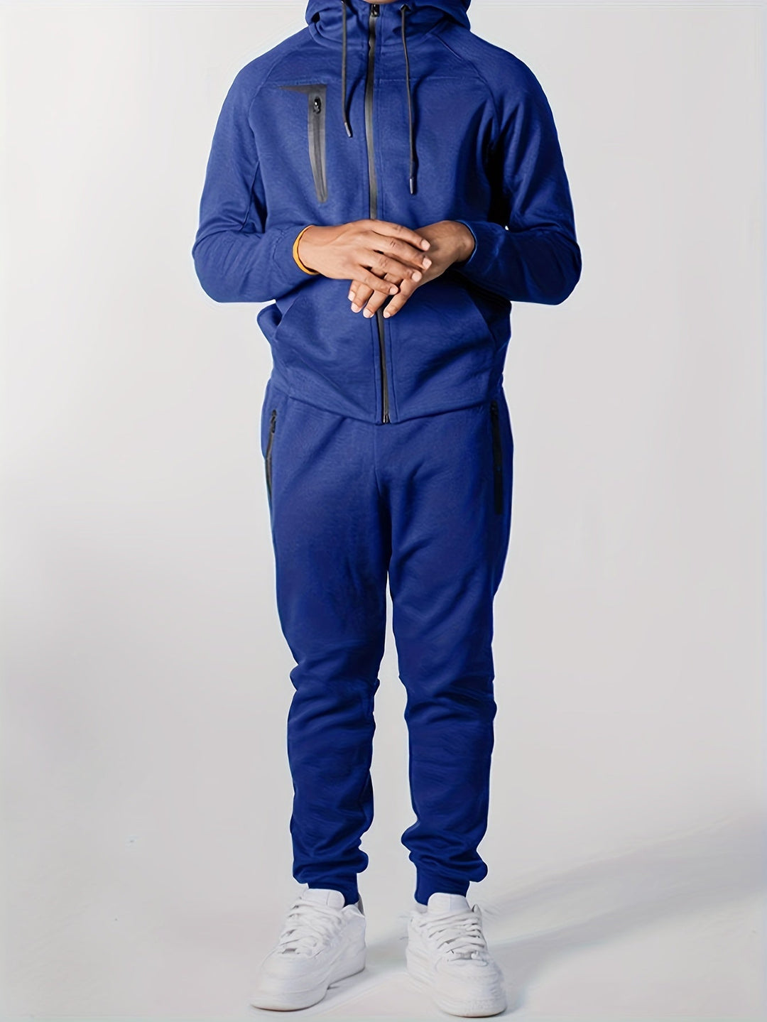 Wygodny męski dres Ruben. Komplet dresowy z bluzą z kapturem i spodniami. Sportowy styl na jesień/wiosnę.