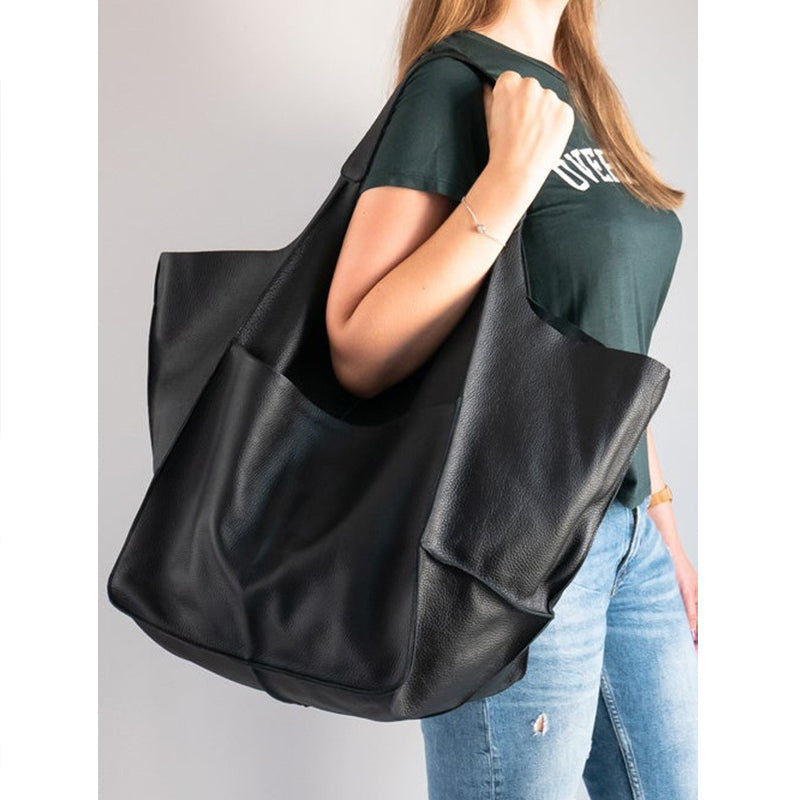 Damska torba vintage z uchwytem i paskiem, wszechstronna i elegancka.