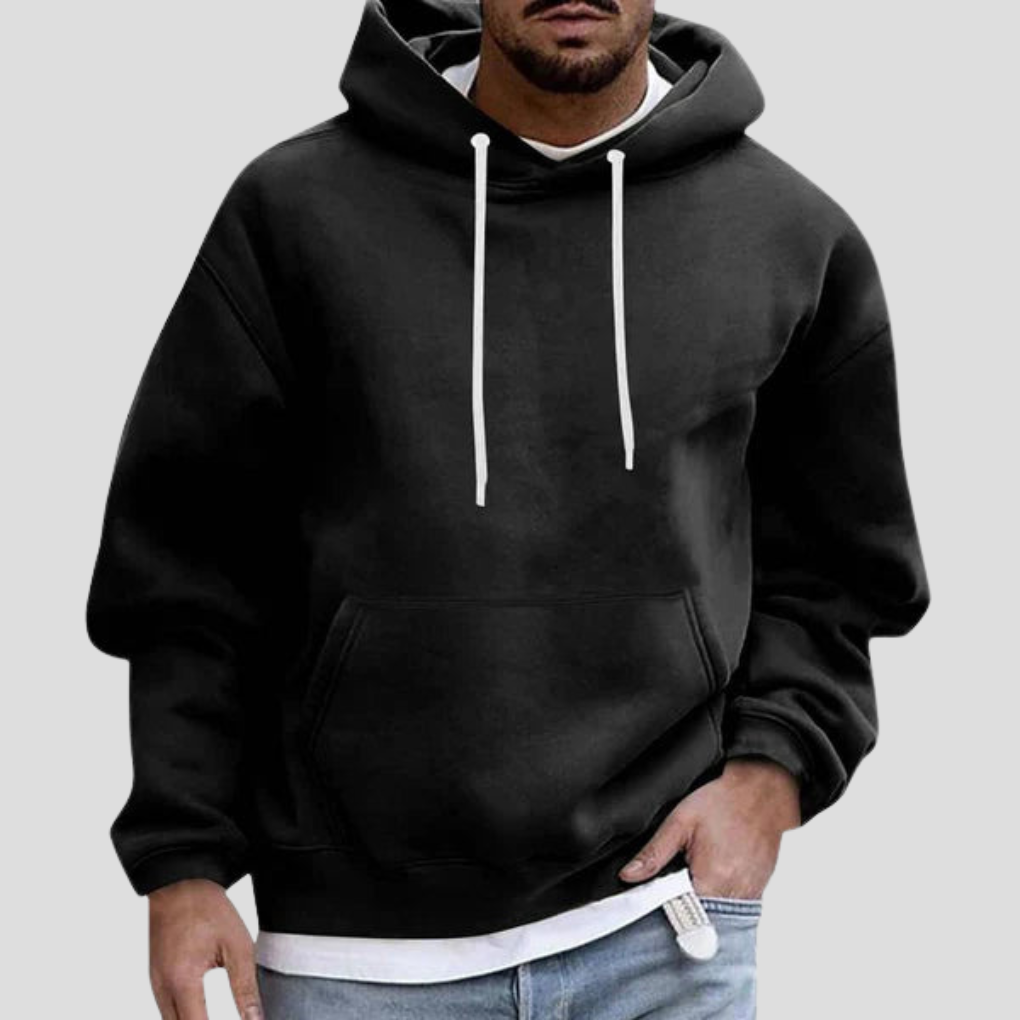 Praktyczne kieszenie w męskiej bluzie z kapturem. Idealna na co dzień, luźny krój. Komfortowa dzianina. Styl casual streetwear.