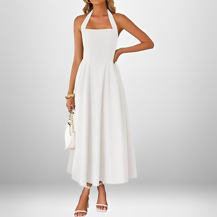 Elegancka sukienka midi halter, idealna na imprezę, randkę czy letnie przyjęcie. Wygodna.