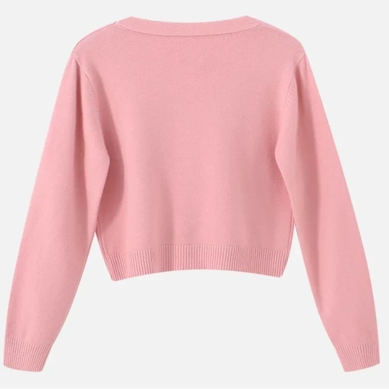 Modny krótki sweter damski V-neck. Luźny, casualowy, na warstwy. Wygodny fason na wiosnę i jesień.