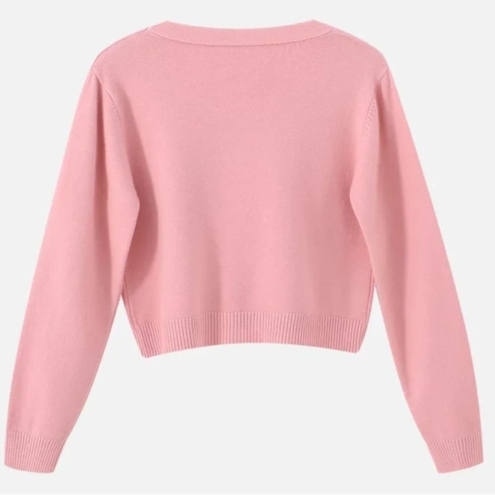Modny krótki sweter damski V-neck. Luźny, casualowy, na warstwy. Wygodny fason na wiosnę i jesień.