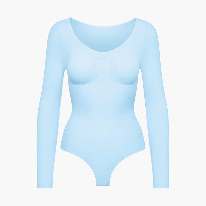 Damskie body modelujące z długim rękawem, bezszwowe. Podkreśla sylwetkę, idealne do jesiennych stylizacji.