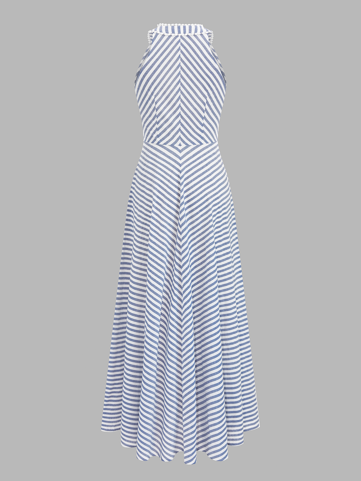 Damska sukienka midi slim fit w modne paski. Dekolt halter podkreśla ramiona. Idealna na upały.