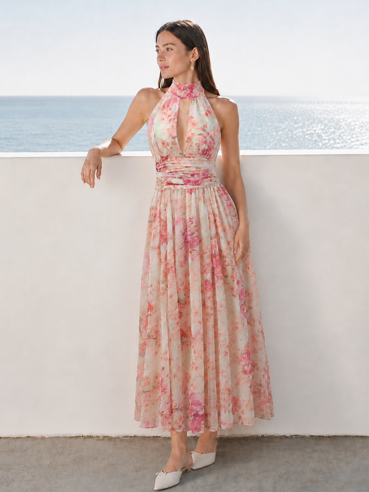 Damska sukienka maxi w kwiaty z dekoltem halter. Elegancka i zwiewna, idealna na lato i przyjęcia.