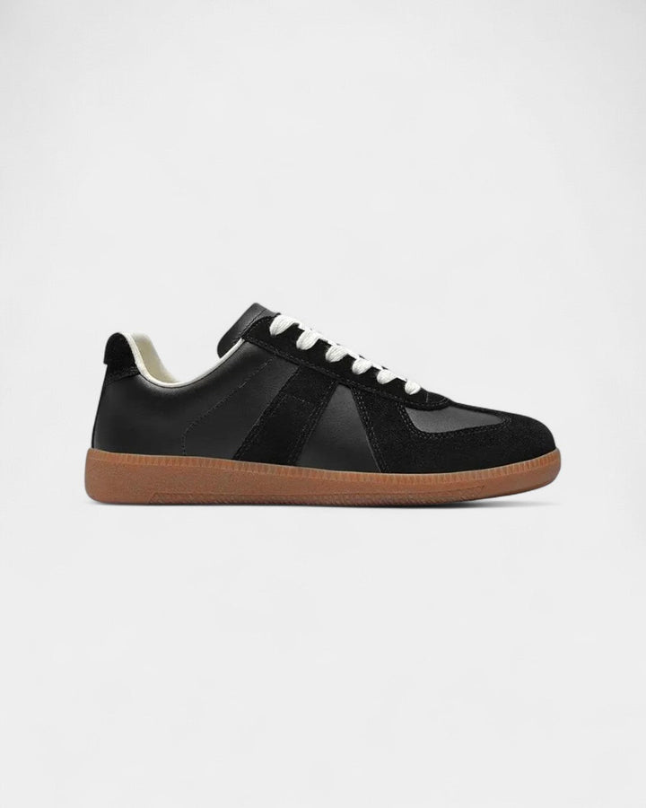 Czarne męskie sneakersy retro, idealne do codziennych stylizacji casual. Wygodne obuwie męskie na wiosnę i jesień.