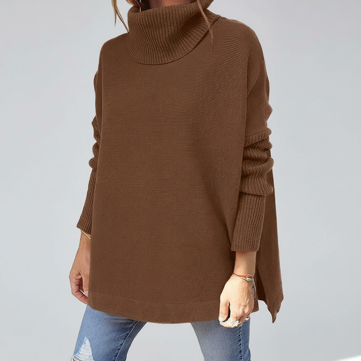 Sweter damski z wysokim golfem, luźny i przyjemny w dotyku. Ciepły, modny, jesienno-zimowy must-have.