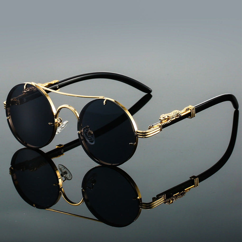 Okrągłe okulary przeciwsłoneczne retro unisex. Metalowa oprawa dodaje im modnego, eleganckiego stylu na lato.