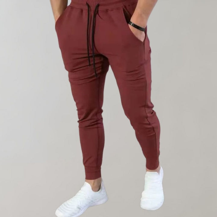 Wygodne męskie spodnie dresowe slim fit do biegania i fitnessu, przewiewna bawełna na wiosnę.