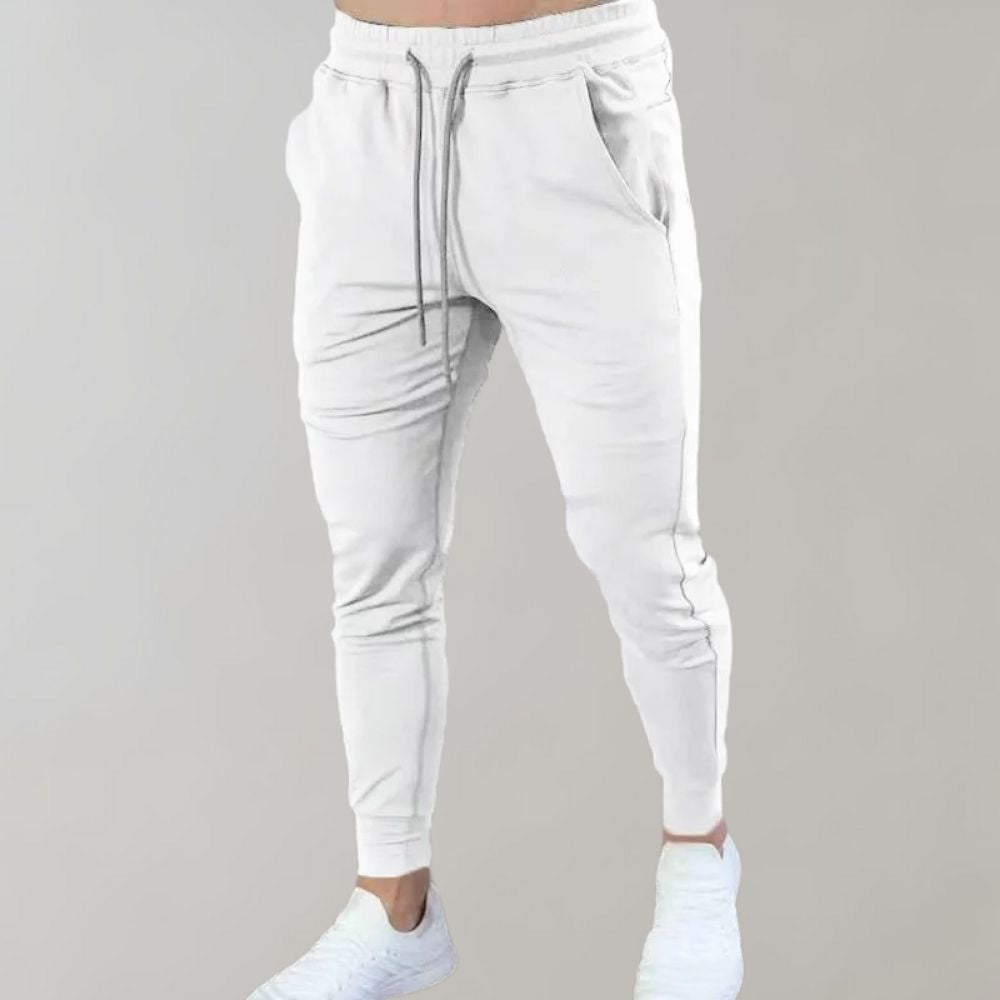 Bawełniane spodnie dresowe męskie slim fit, przewiewne i wygodne na wiosnę. Joggery sportowe.