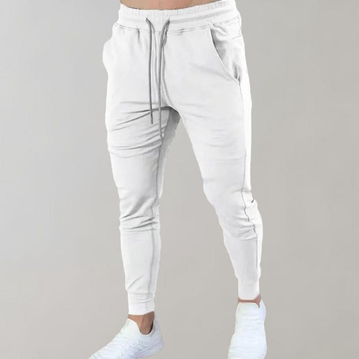 Bawełniane spodnie dresowe męskie slim fit, przewiewne i wygodne na wiosnę. Joggery sportowe.