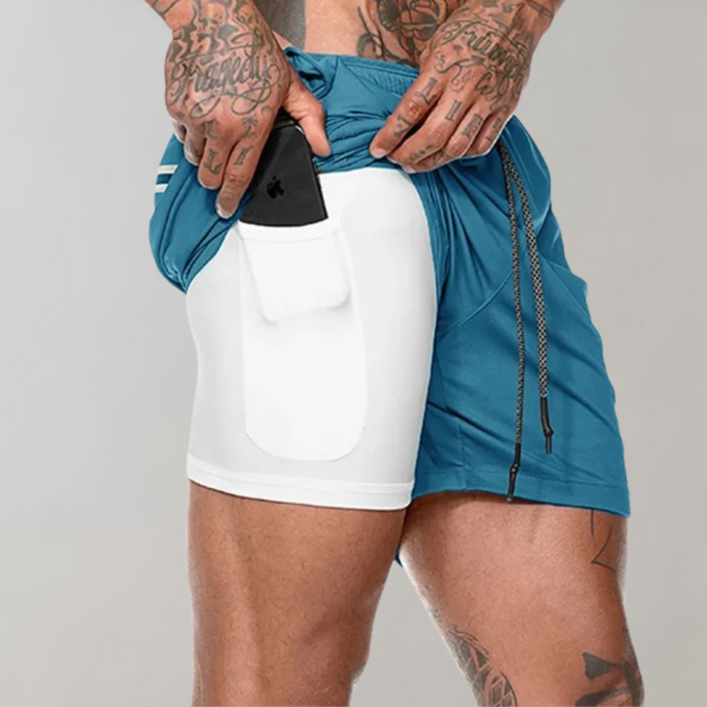 Detale męskich spodenek sportowych 2w1: szybkoschnący materiał i elastyczny pas. Komfort na siłowni.