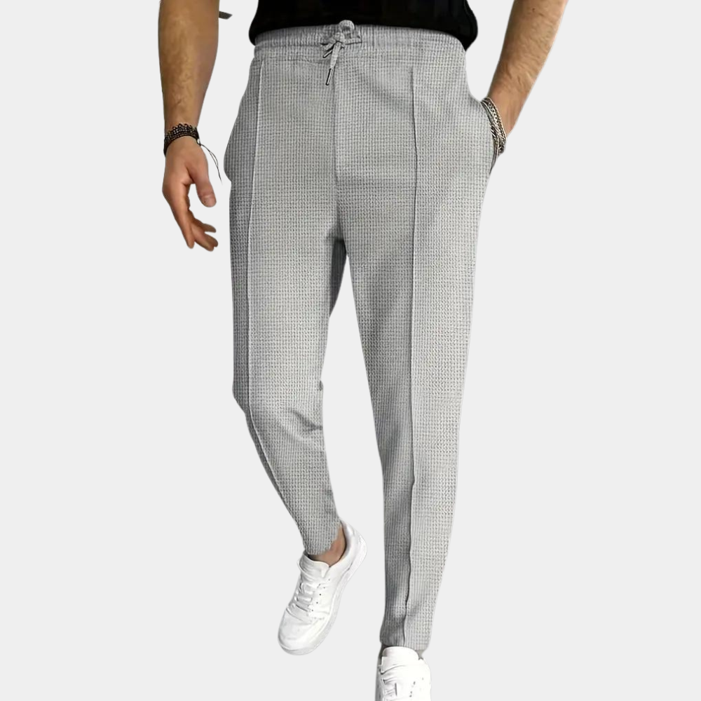 Męskie joggery bawełniane casual ze stretchem, modne spodnie dresowe do stylizacji miejskich na wiosnę-lato.