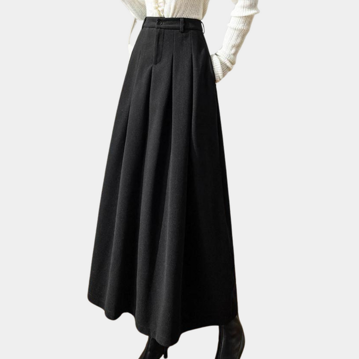 Elegancka damska spódnica midi. Uniwersalny klasyczny krój, czarna lub kawowa. Stylowa i komfortowa.