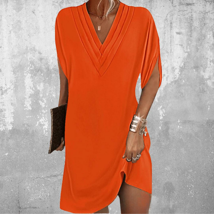 Damska sukienka midi V-neck w kolorze czarnym. Elegancka i komfortowa stylizacja na wiosnę.