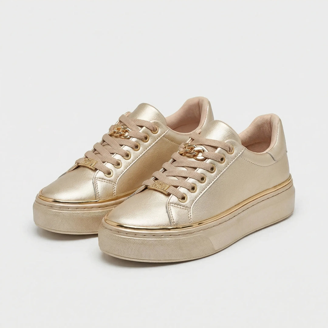 Stylowe damskie sneakersy na platformie ze złotymi akcentami. Wygodne i modne obuwie do codziennych outfitów.