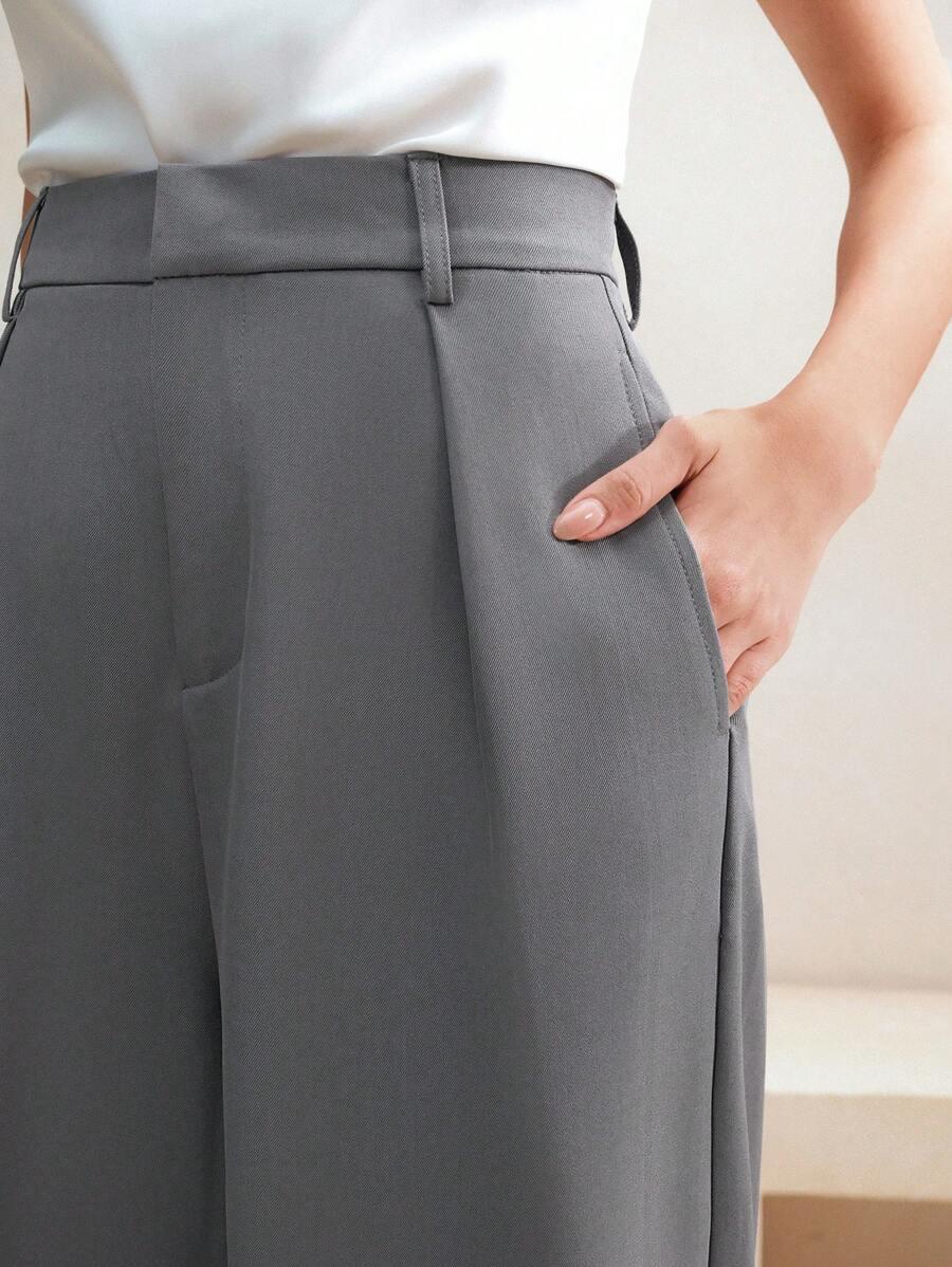 Eleganckie spodnie damskie z wysokim stanem. Szerokie nogawki, całoroczne. Idealne do biura.