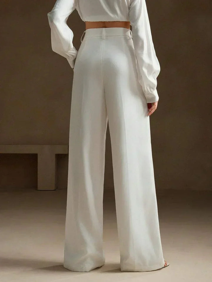 Eleganckie spodnie damskie z wysokim stanem. Szerokie nogawki, modne, całoroczne dla kobiet.