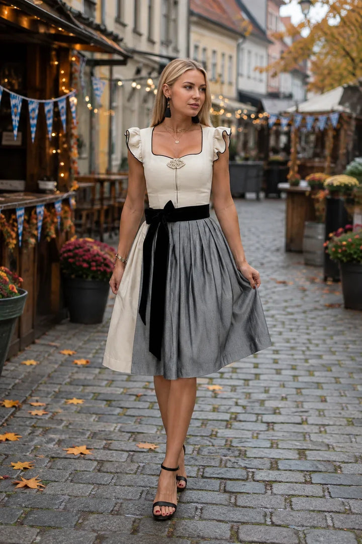 Elegancka sukienka bawarska midi, z patchworkowymi wstawkami i długim rękawem, dla kobiet na Oktoberfest.