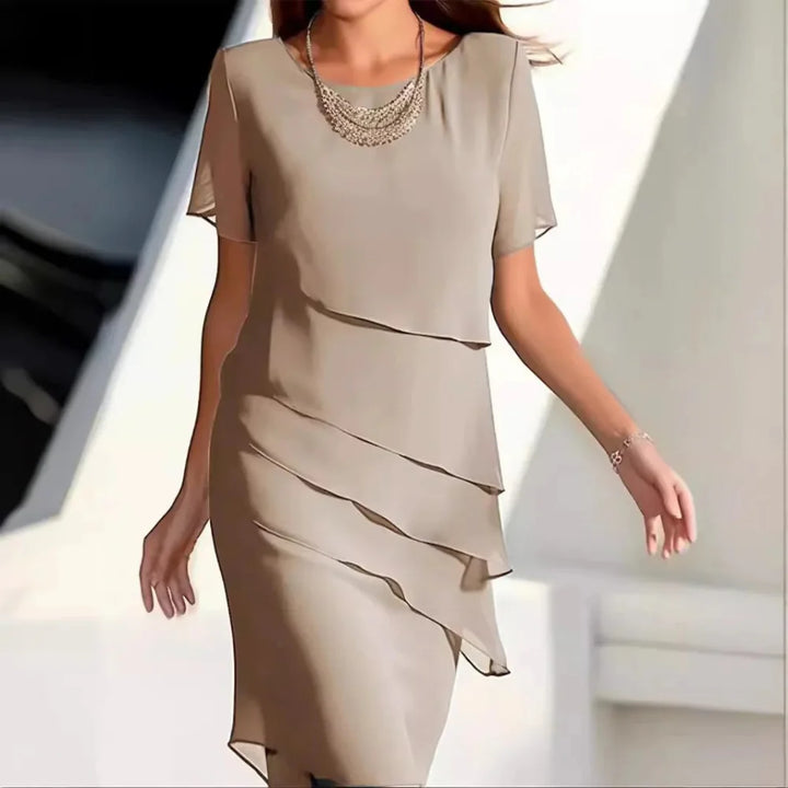 Elegancka damska sukienka midi z szyfonu, idealna na lato i wiosnę. Luksusowa i komfortowa moda damska.
