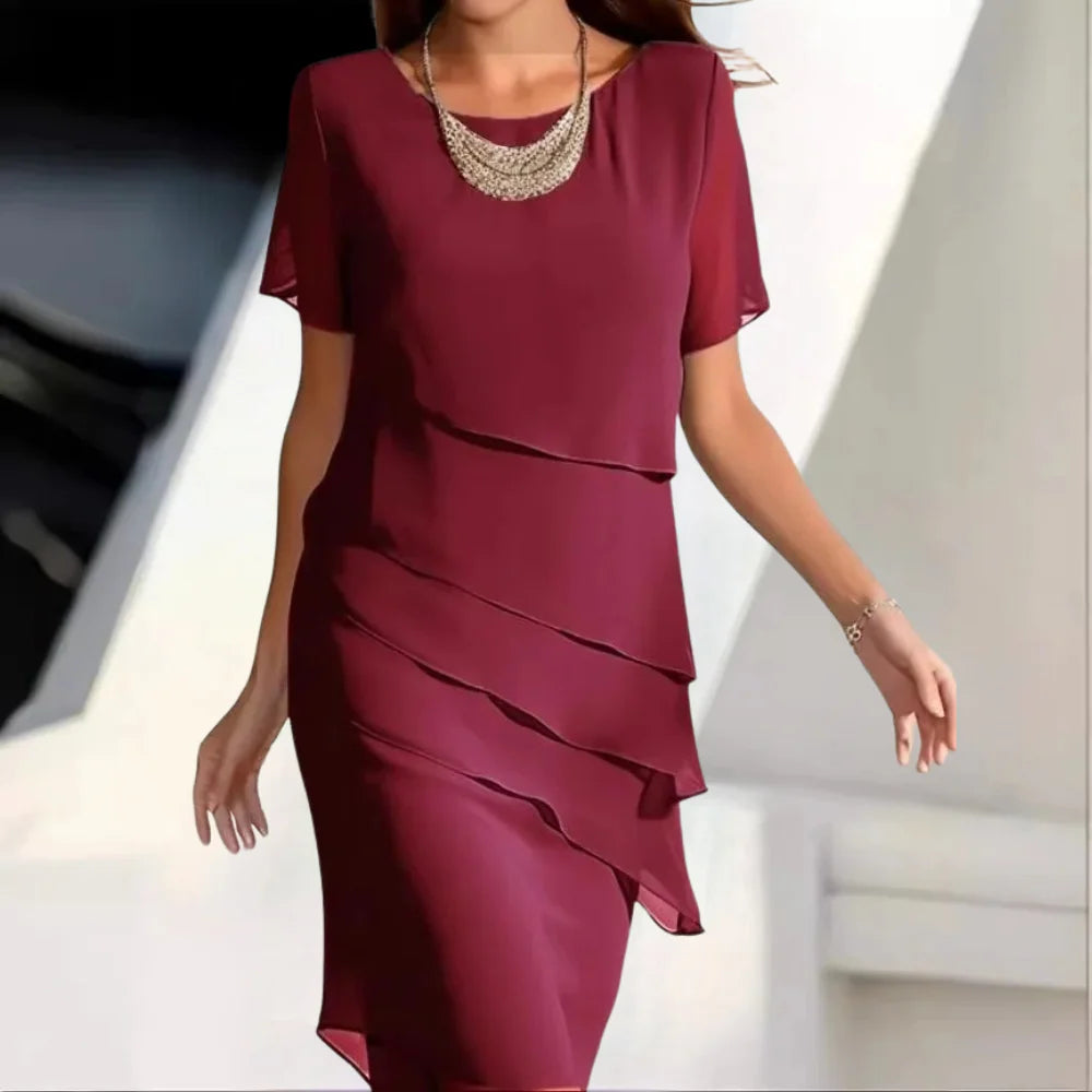 Damska sukienka midi z szyfonu, elegancka i komfortowa, idealna na wieczór lub specjalne okazje. Moda letnia.