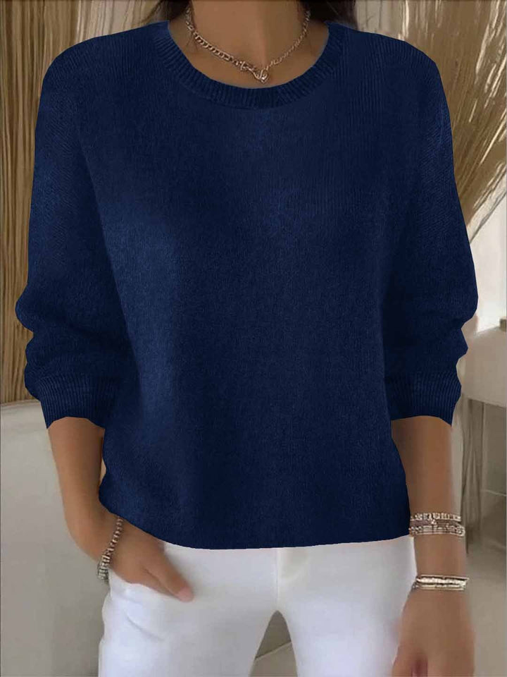 Stylowy sweter damski na jesień/zimę. Okrągły dekolt, luźny krój, ciepła dzianina.